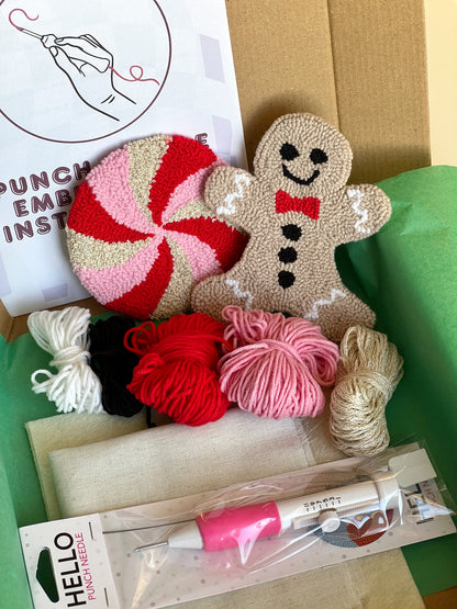 Punch needle kit box with gingerbread man and peppermint coasters, yarn, hoop and needle