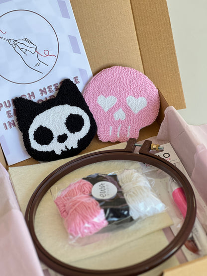 Punch needle kit box with cat skull and pink skull coasters, yarn, hoop and needle
