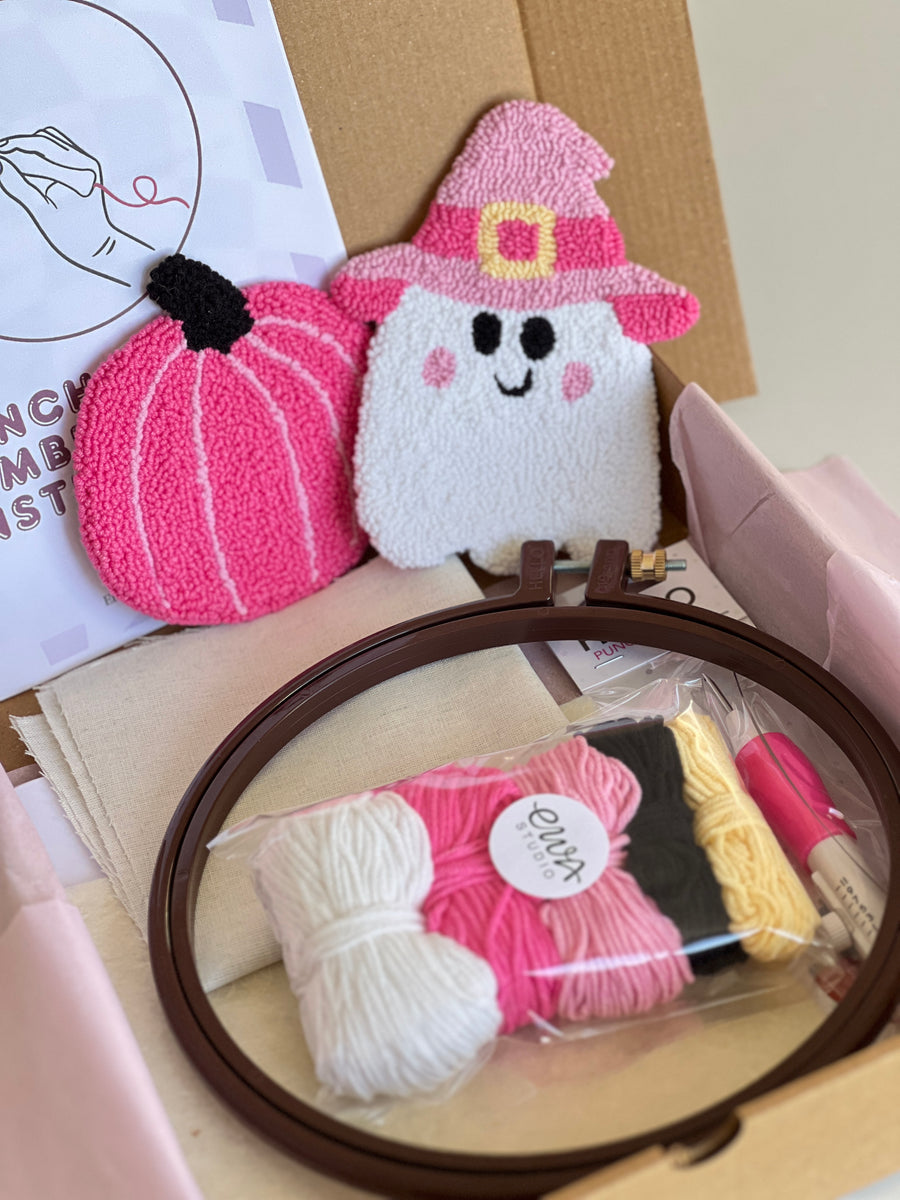 Punch needle kit box with pink pumpkin and witch hat ghost coasters, yarn, hoop and needle