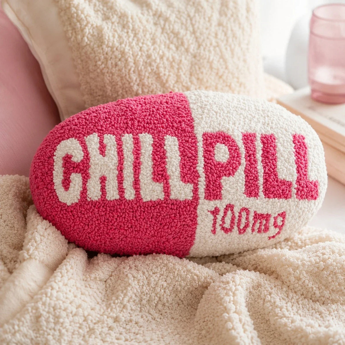 Close-up of the Chill Pill pillow punch needle texture on a cream chair